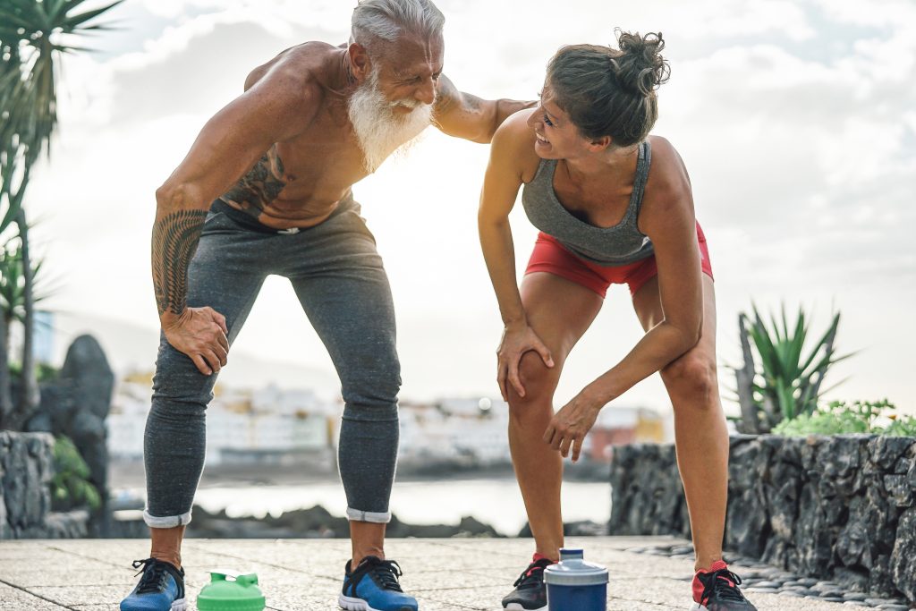 Man and a woman having break after a race